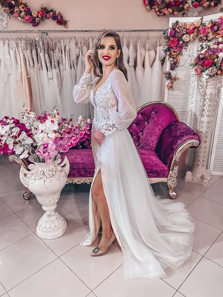 ---Very special and sensual wedding dress with detachable tulle train, deep V neckline and long sleeves decorated with sequins a