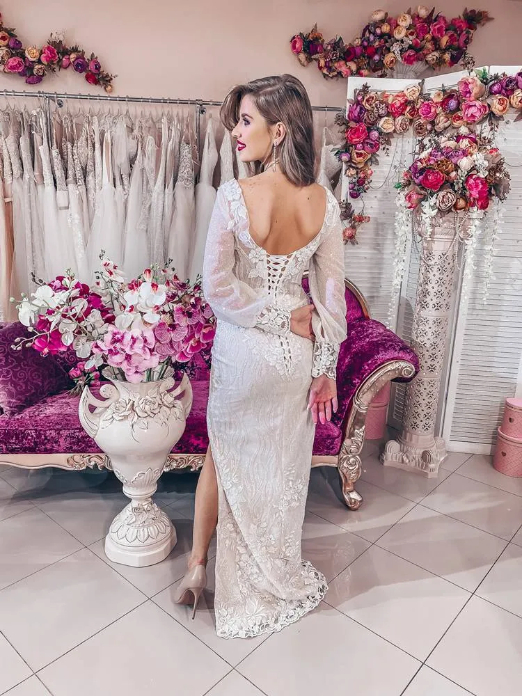 ---Very special and sensual wedding dress with detachable tulle train, deep V neckline and long sleeves decorated with sequins a